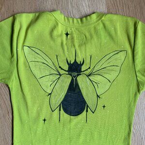 Big Bud Press Baby Tee with painted rhinocerous beetle